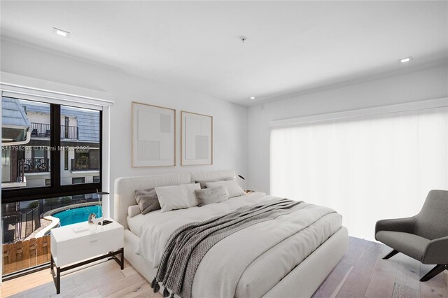 204 Sunrise Dr Unit 204D, Key Biscayne, FL 33149 - bedroom with wood finished floors, multiple windows, and recessed lighting
