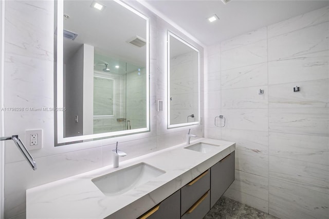 204 Sunrise Dr Unit 204D, Key Biscayne, FL 33149 - bathroom featuring tile walls, double vanity, and a shower