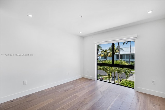 204 Sunrise Dr Unit 204D, Key Biscayne, FL 33149 - empty room with wood finished floors, baseboards, and recessed lighting