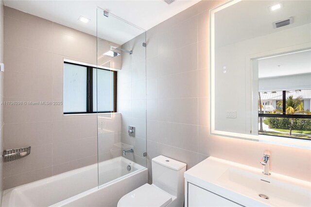 204 Sunrise Dr Unit 204D, Key Biscayne, FL 33149 - full bath featuring tile walls, vanity, toilet, and shower / tub combination