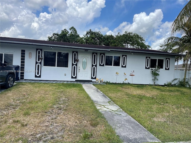 19201 SW 318th Ter, Homestead, FL 33030 - ranch-style house featuring stucco siding and a front lawn
