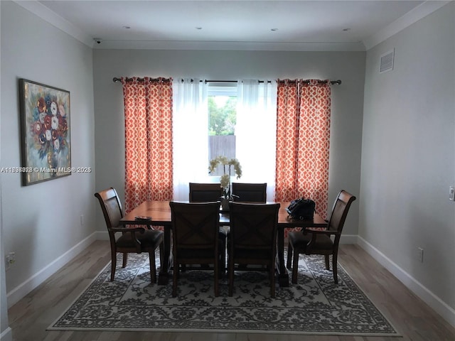 1010 NE 36th Ave, Homestead, FL 33033 - dining room with wood finished floors, baseboards, and crown molding