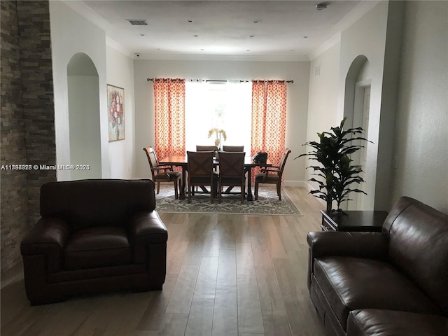 1010 NE 36th Ave, Homestead, FL 33033 - living area with wood finished floors, arched walkways, and ornamental molding