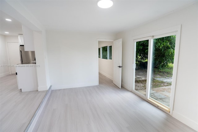 3531 NW 26th St, Lauderdale Lakes, FL 33311 - empty room with light wood-type flooring, baseboards, and recessed lighting