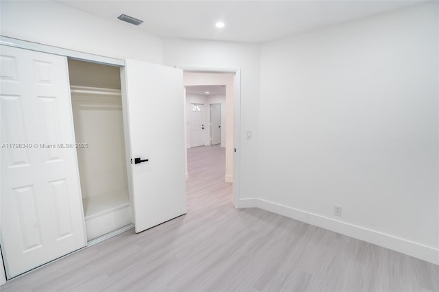 3531 NW 26th St, Lauderdale Lakes, FL 33311 - unfurnished bedroom with light wood finished floors, recessed lighting, baseboards, and a closet
