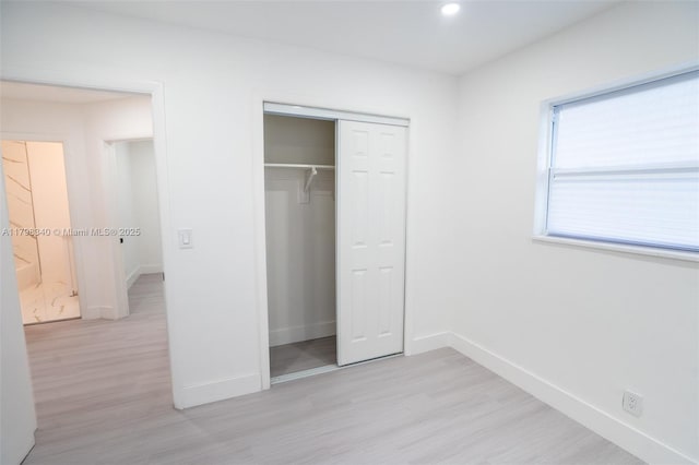 3531 NW 26th St, Lauderdale Lakes, FL 33311 - unfurnished bedroom with light wood-style flooring, baseboards, a closet, and recessed lighting