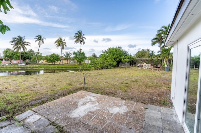 3531 NW 26th St, Lauderdale Lakes, FL 33311 - view of green lawn featuring a patio and a water view