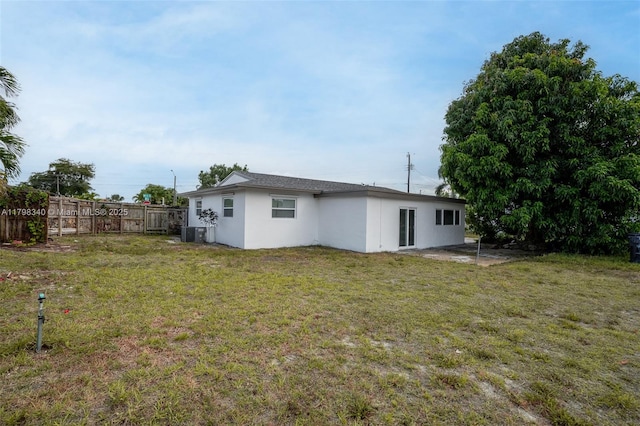 3531 NW 26th St, Lauderdale Lakes, FL 33311 - back of property with stucco siding and cooling unit