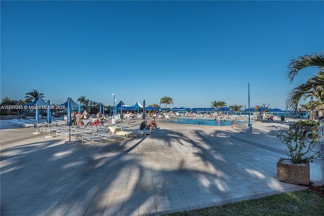 view of jungle gym with a community pool