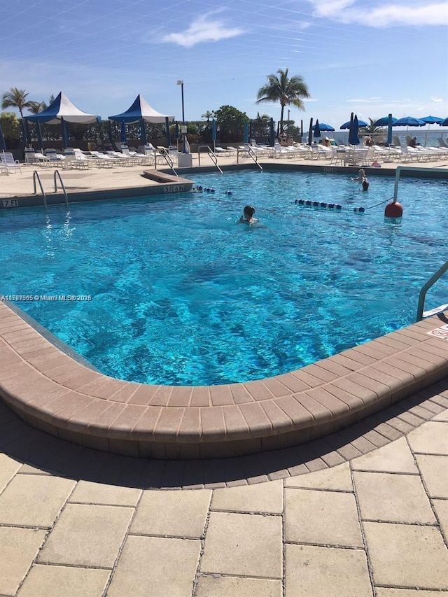 community pool featuring a patio area