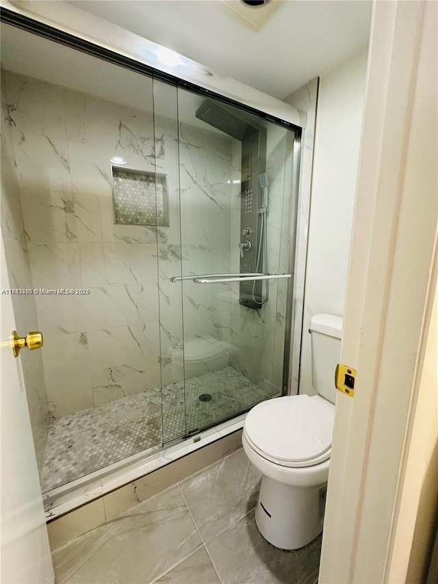 full bath featuring marble finish floors, toilet, and a marble finish shower