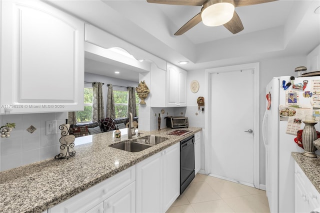 kitchen with a sink, freestanding refrigerator, dishwasher, a ceiling fan, and tasteful backsplash
