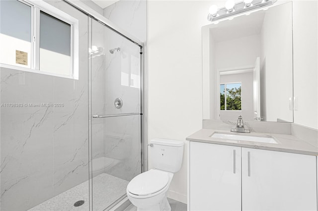 bathroom with a marble finish shower, toilet, and vanity