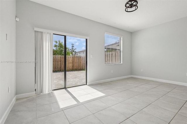 28625 SW 132nd Ct, Homestead, FL 33033 - unfurnished room with healthy amount of natural light, tile patterned flooring, and baseboards