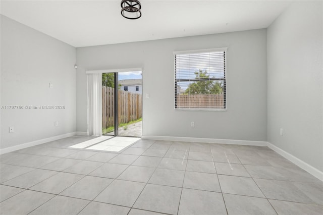 28625 SW 132nd Ct, Homestead, FL 33033 - unfurnished room with light tile patterned flooring and baseboards