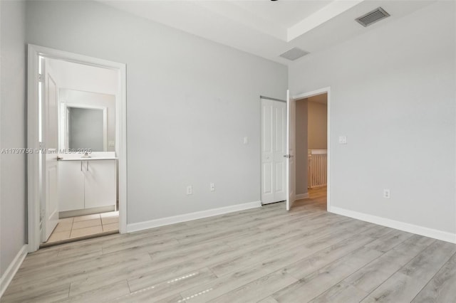 28625 SW 132nd Ct, Homestead, FL 33033 - unfurnished bedroom with light wood-style flooring, ensuite bath, and baseboards