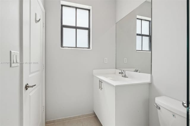 28625 SW 132nd Ct, Homestead, FL 33033 - half bathroom featuring vanity, toilet, baseboards, and tile patterned flooring