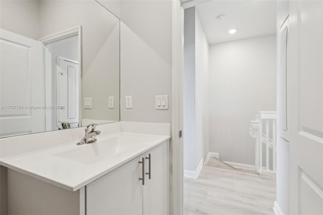 28625 SW 132nd Ct, Homestead, FL 33033 - bathroom featuring wood finished floors, vanity, baseboards, and recessed lighting