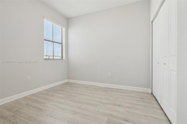 28625 SW 132nd Ct, Homestead, FL 33033 - unfurnished bedroom with a closet, baseboards, and light wood-style floors