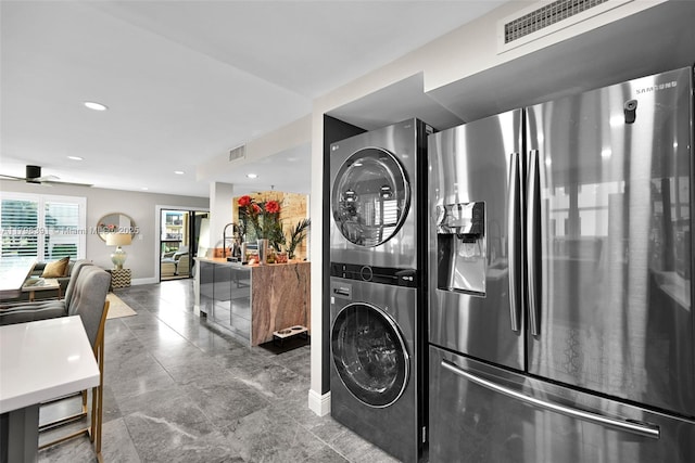 laundry room with stacked washer / dryer, baseboards, ceiling fan, and recessed lighting