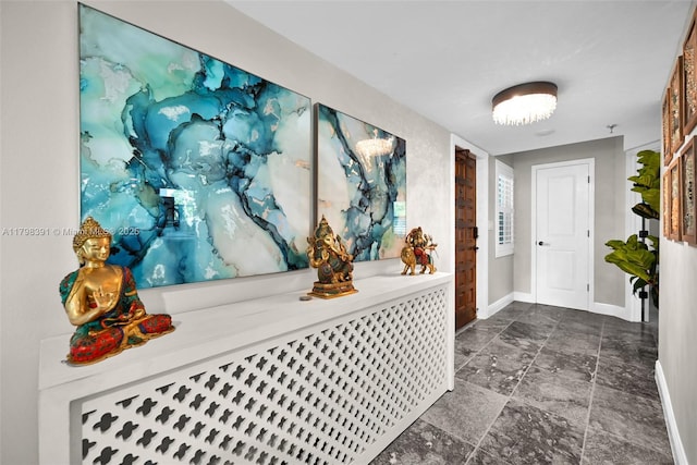 hallway featuring baseboards