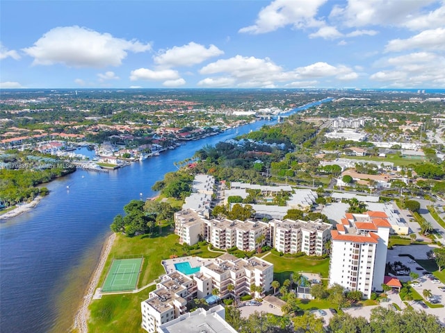 bird's eye view of a large body of water and apartment complex