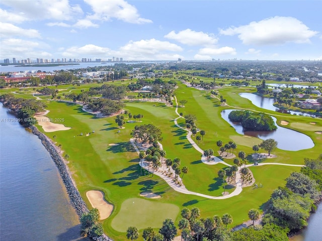 bird's eye view of a view of skyline, a nearby body of water, and a golf club