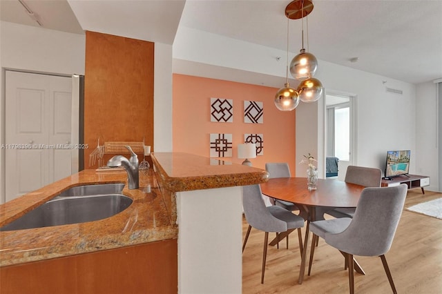 dining room featuring light wood-style floors