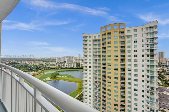 balcony featuring a city view and a water view