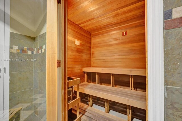 relaxing sauna with wooden ceiling and wood walls
