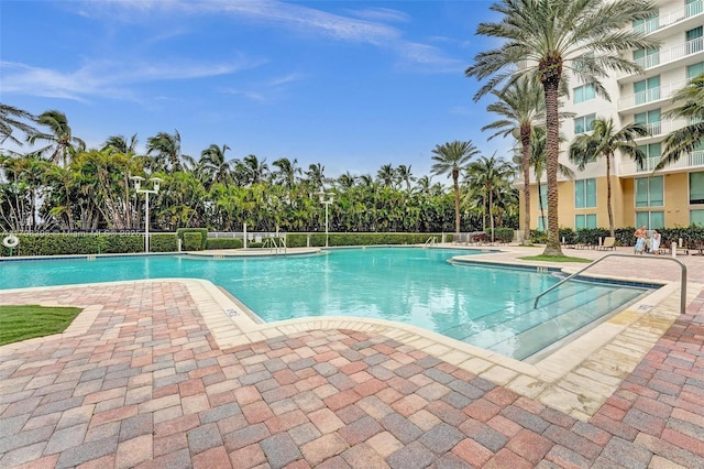 community pool featuring a patio area