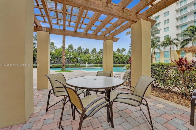 view of patio featuring a pergola and a community pool