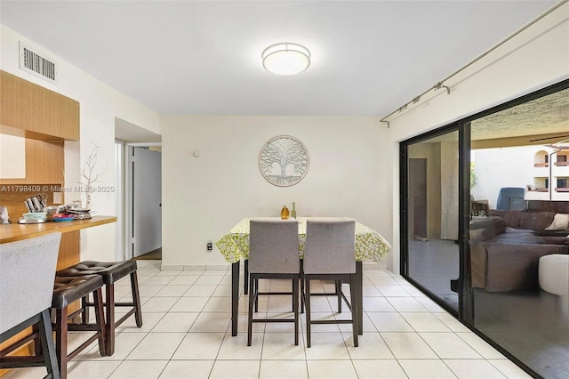 dining room with light tile patterned floors