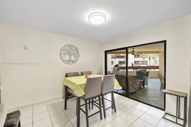 dining space featuring light tile patterned floors and a ceiling fan