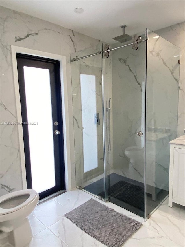 bathroom with marble look tile flooring, toilet, and a marble finish shower