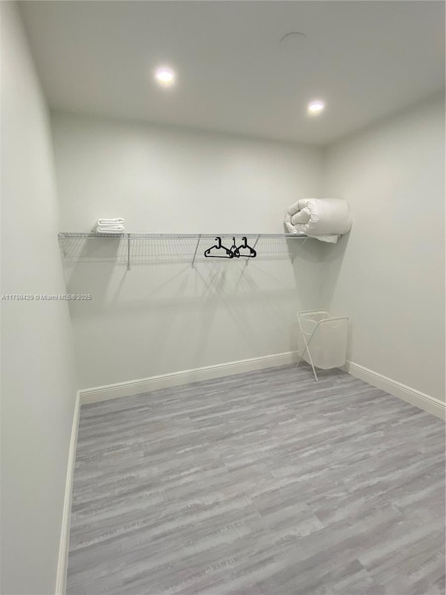 spacious closet with wood finished floors