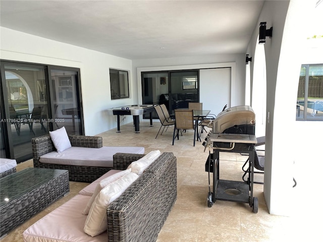 view of patio with an outdoor living space and outdoor dining area