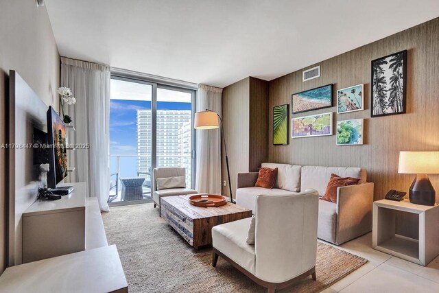 living room featuring floor to ceiling windows