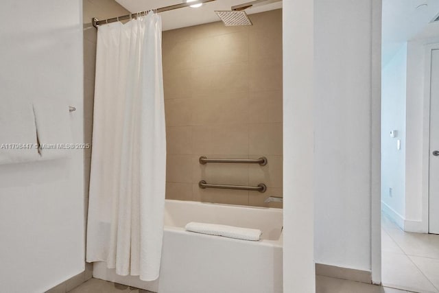 full bathroom with shower / bathtub combination with curtain, tile patterned floors, and baseboards