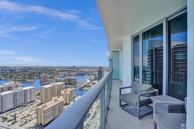 balcony with a city view and a water view