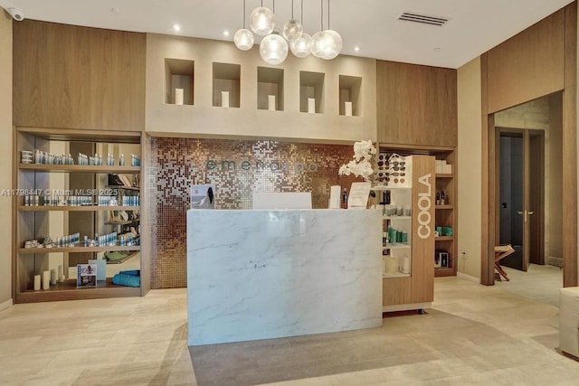 reception area with a security system and recessed lighting