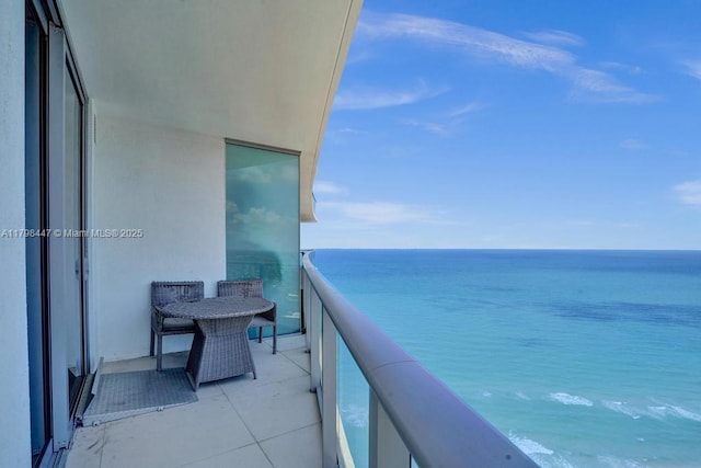 balcony featuring a water view