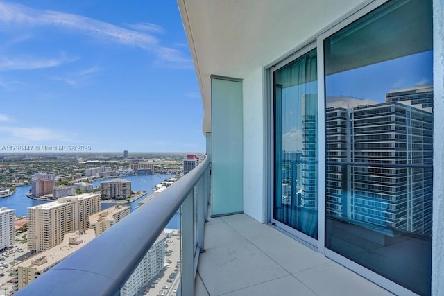 balcony with a city view and a water view