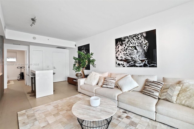 living room with light tile patterned floors