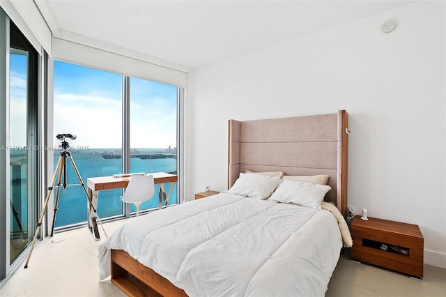bedroom featuring a water view