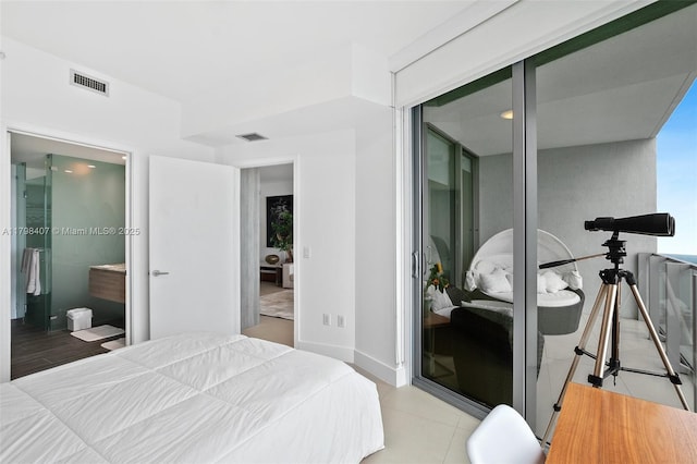 bedroom with a closet and tile patterned flooring