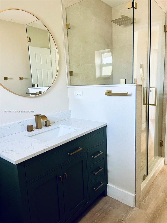 1300 Waite Dr, Fort Myers, FL 33903 - full bath with wood finished floors, vanity, and a shower stall