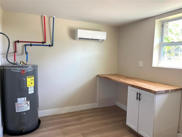 1300 Waite Dr, Fort Myers, FL 33903 - utilities with water heater and a wall mounted air conditioner