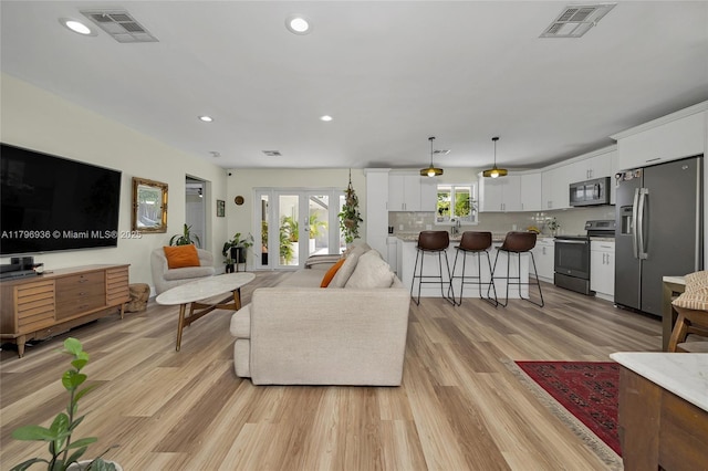2221 N 46th Ave, Hollywood, FL 33021 - living room featuring light wood-type flooring and recessed lighting