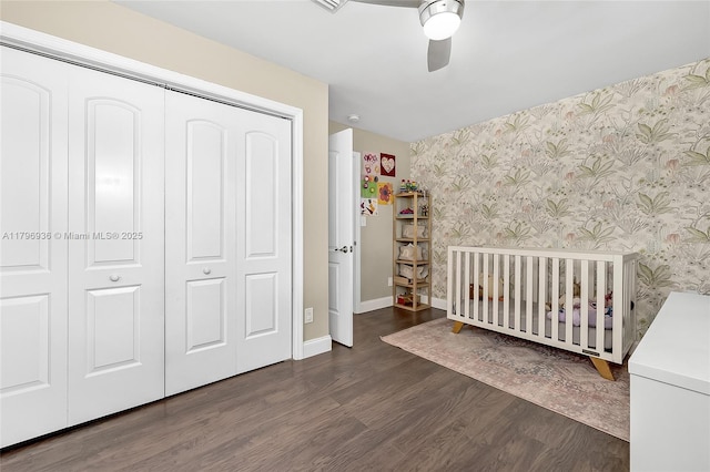 2221 N 46th Ave, Hollywood, FL 33021 - bedroom with wallpapered walls, wood finished floors, a closet, baseboards, and a nursery area